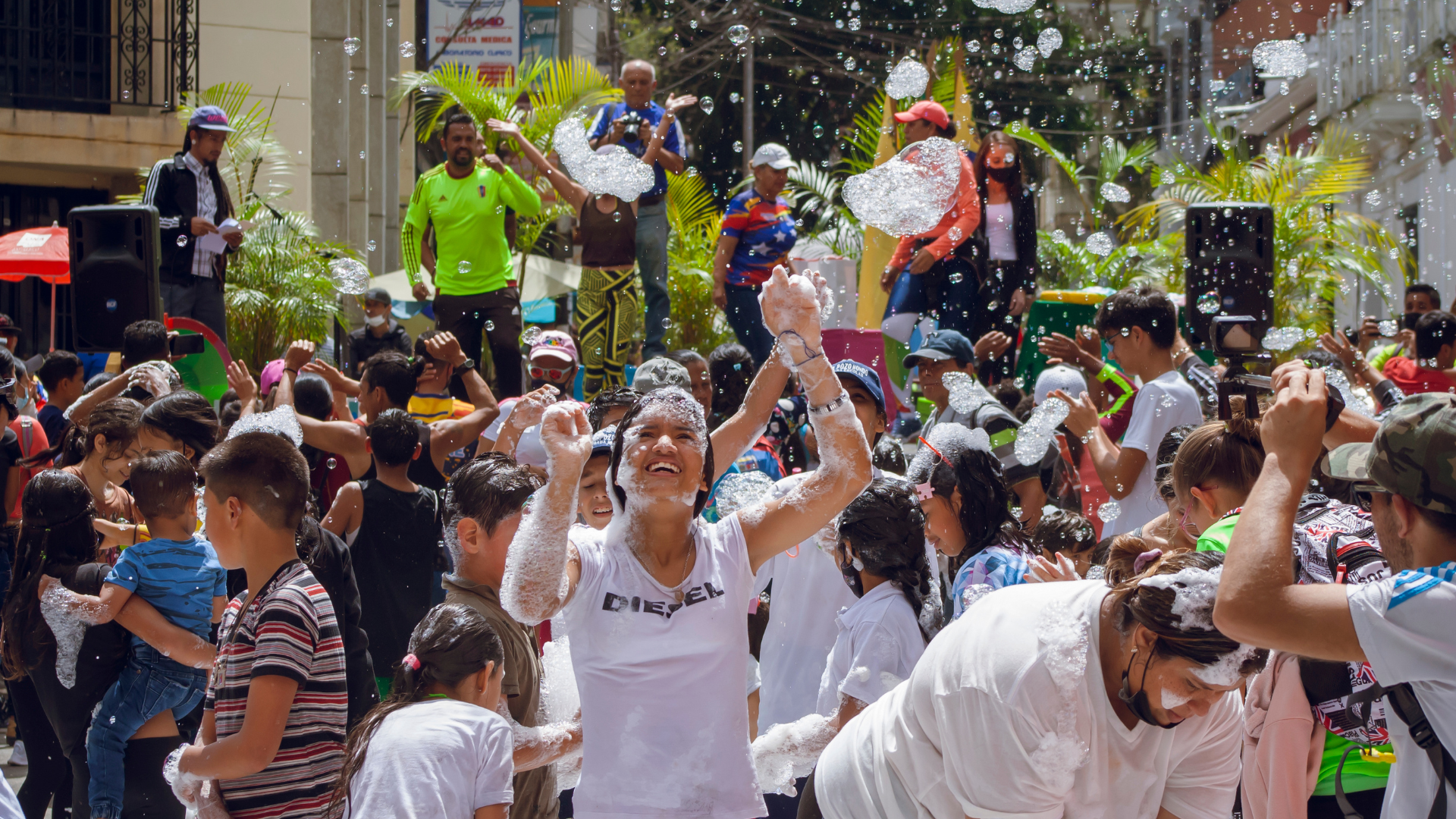 People of all ages taking part in fun active activities with bubbles.